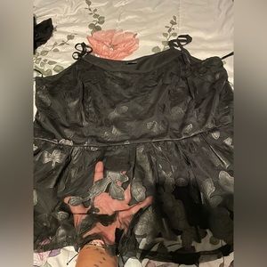 Torrid size 3 black sheer top with lining. Cami peplum style.